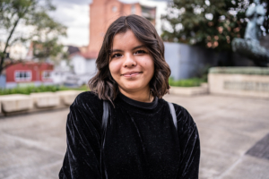 Portrait of a young university woman student outdoors